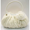 Combination of knit and synthetic leather bag.